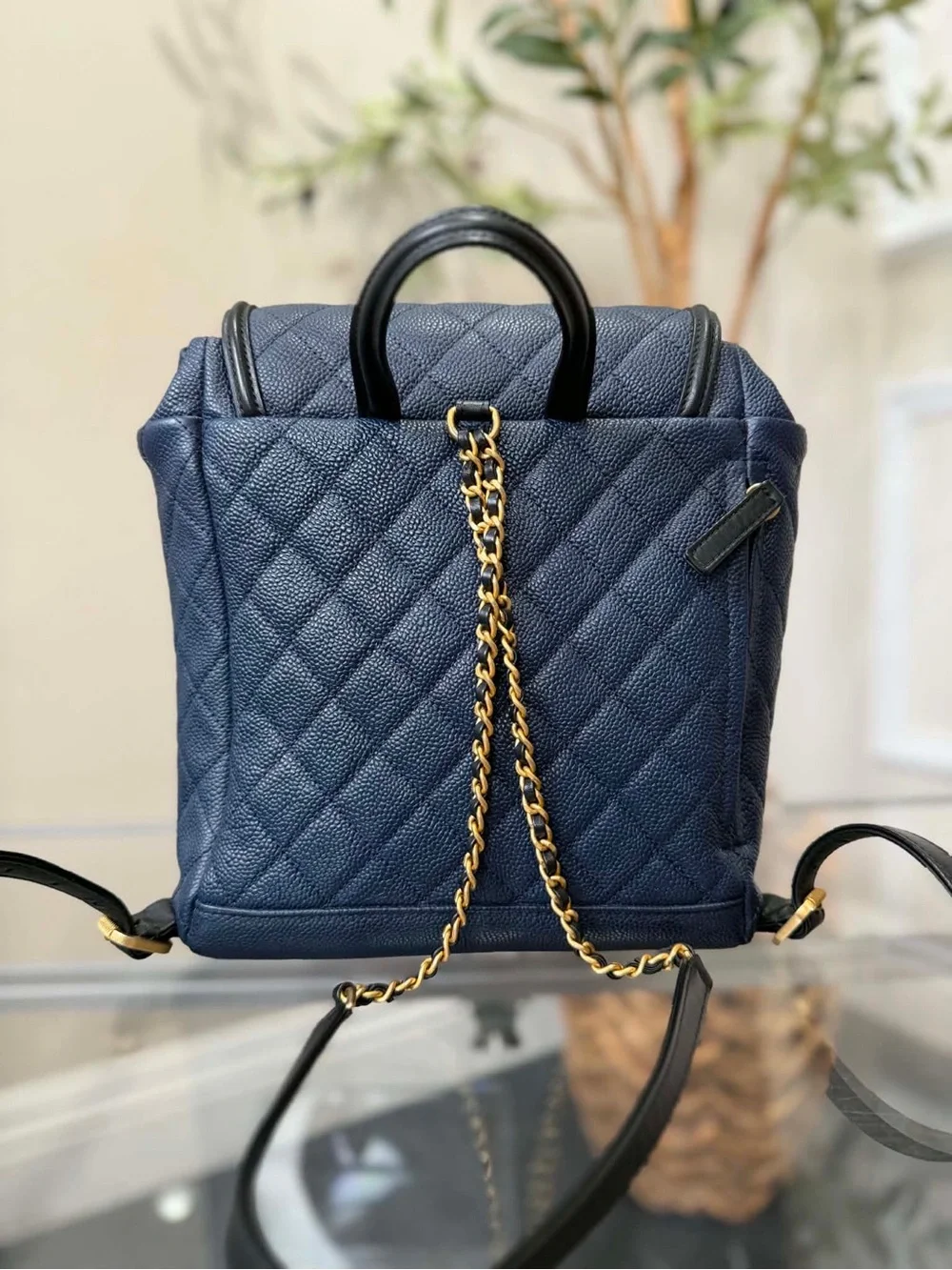 CHANEL Quilted Navy Caviar Leather Backpack with Gold Hardware
